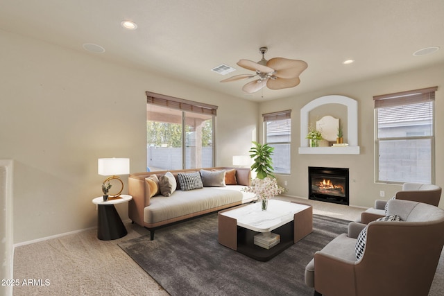 living room featuring ceiling fan and carpet flooring