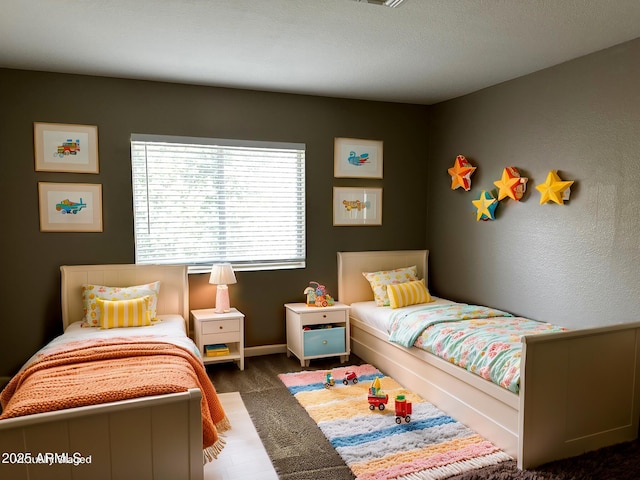 bedroom featuring baseboards