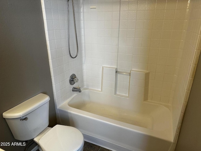 bathroom with toilet and  shower combination