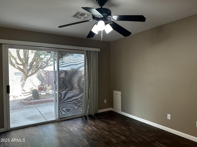 unfurnished room featuring visible vents, wood finished floors, baseboards, and ceiling fan