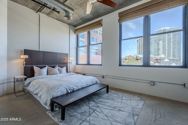 bedroom with a ceiling fan and carpet floors