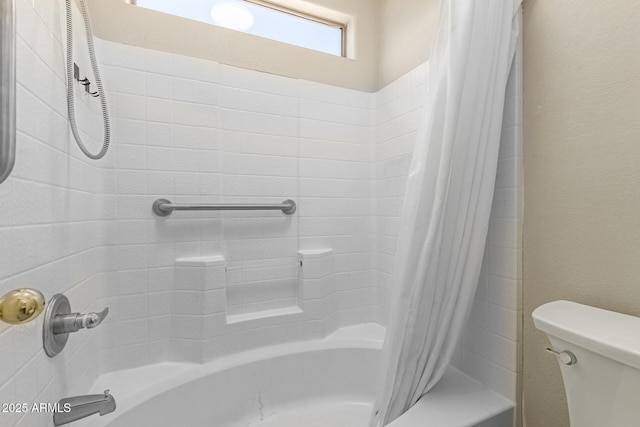 bathroom featuring toilet and shower / tub combo with curtain