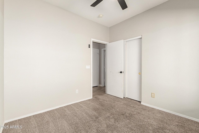 unfurnished bedroom featuring ceiling fan and carpet floors