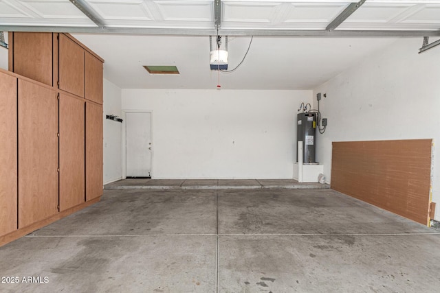 garage with electric water heater and a garage door opener