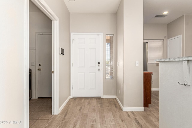 entrance foyer with light hardwood / wood-style floors