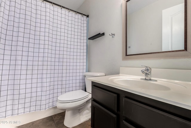 bathroom featuring walk in shower, tile patterned floors, vanity, and toilet