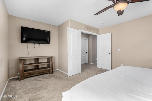 carpeted bedroom featuring ceiling fan