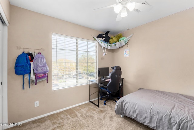 carpeted bedroom with ceiling fan