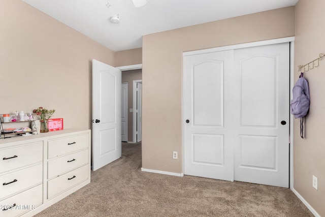 carpeted bedroom featuring a closet