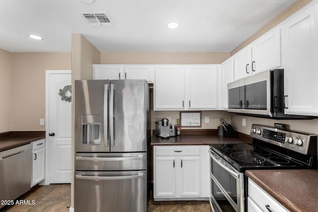 kitchen featuring white cabinetry and appliances with stainless steel finishes