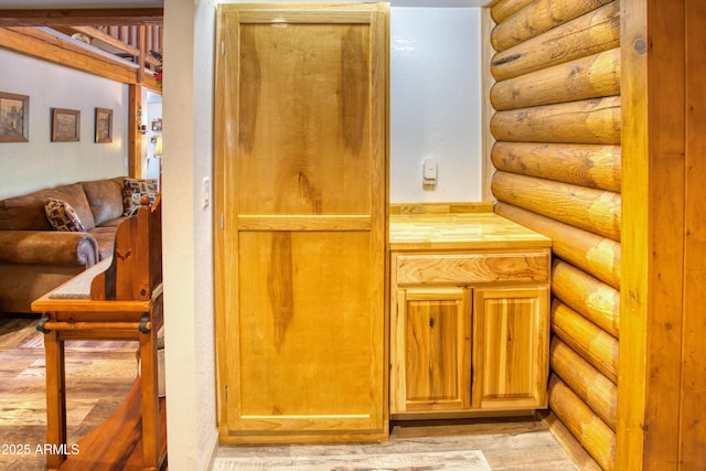 detailed view of log walls and wood finished floors