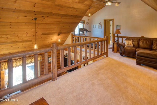 carpeted living area featuring wooden ceiling, high vaulted ceiling, and a ceiling fan