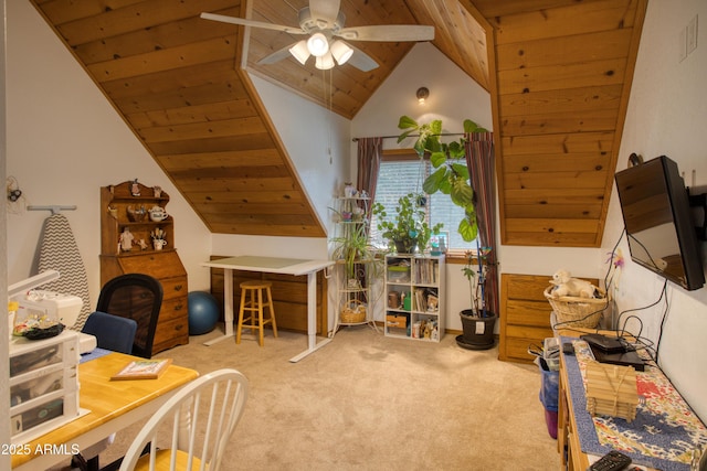 interior space featuring a ceiling fan, lofted ceiling, and wooden ceiling