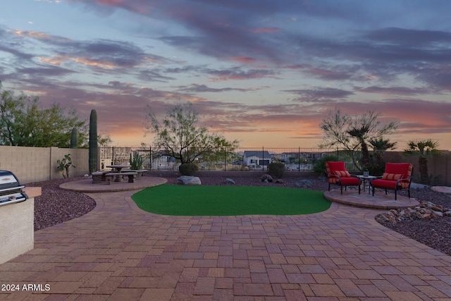 patio terrace at dusk with a fire pit