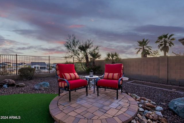 view of patio terrace at dusk