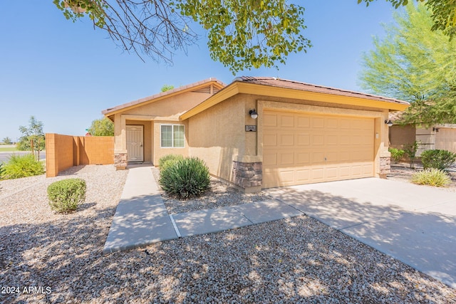 368 S 18th St, Coolidge, AZ 85128 - view of front of property with driveway, fence, a tiled roof, a garage, and stucco siding