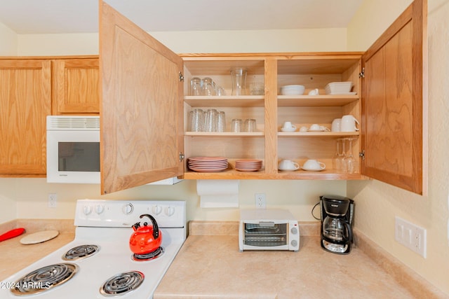 368 S 18th St, Coolidge, AZ 85128 - kitchen with white appliances, light countertops, and open shelves