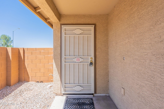 368 S 18th St, Coolidge, AZ 85128 - doorway to property with stucco siding and fence