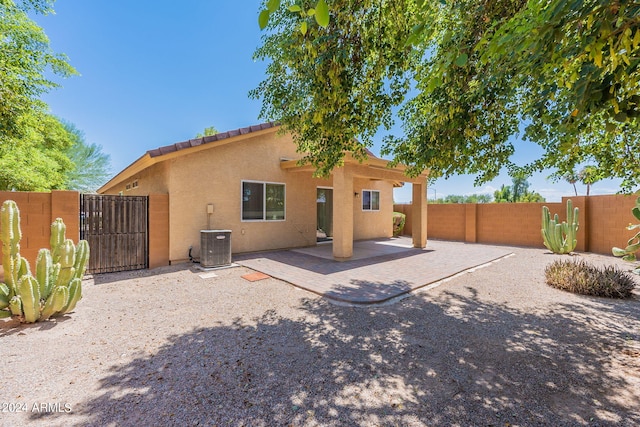 368 S 18th St, Coolidge, AZ 85128 - back of property featuring stucco siding, central air condition unit, fence, a gate, and a patio area