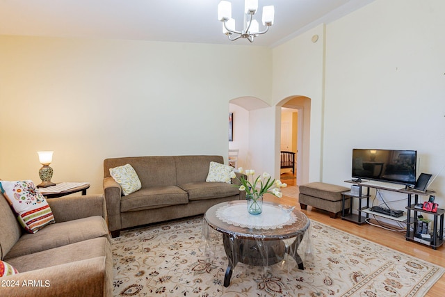 368 S 18th St, Coolidge, AZ 85128 - living room with arched walkways, wood finished floors, and a notable chandelier