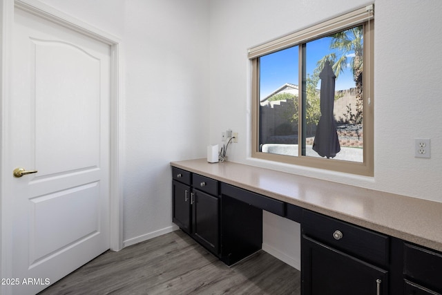 interior space with vanity and hardwood / wood-style flooring