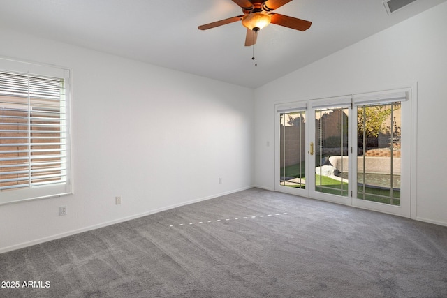 unfurnished room featuring ceiling fan, lofted ceiling, and carpet flooring