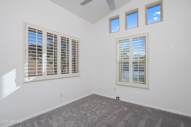 carpeted empty room featuring ceiling fan and vaulted ceiling