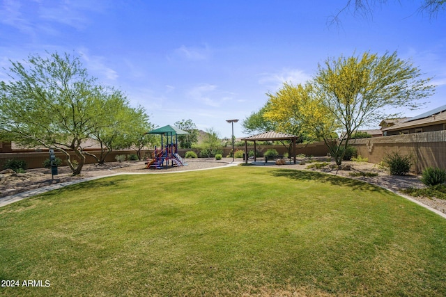 view of yard with a gazebo and a playground