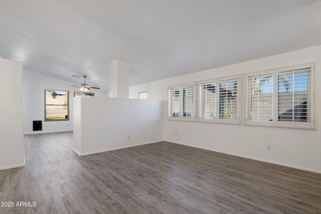 unfurnished room featuring ceiling fan, vaulted ceiling, and dark hardwood / wood-style floors