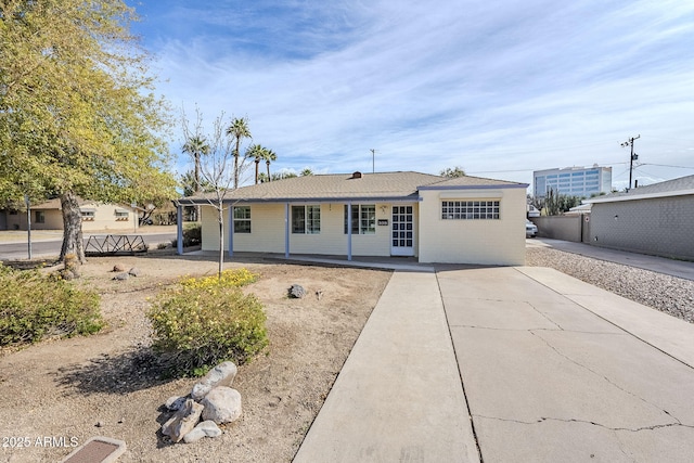 ranch-style home with a patio area and fence