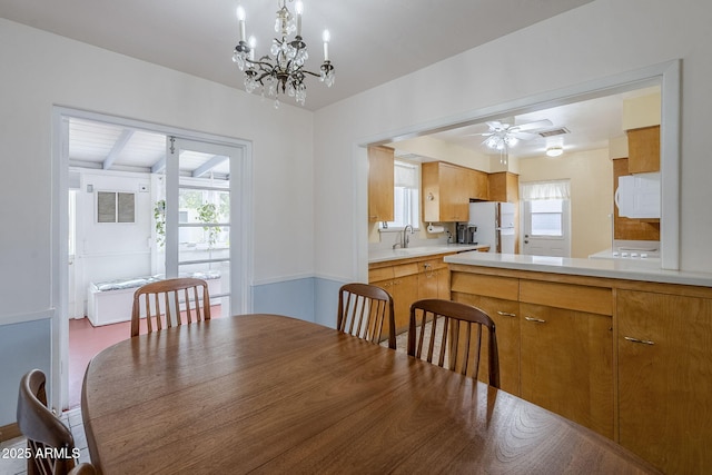 dining area with visible vents and a ceiling fan