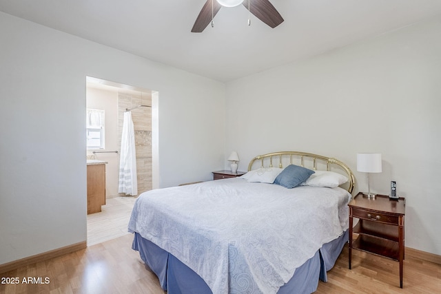 bedroom featuring light wood finished floors, baseboards, and a ceiling fan