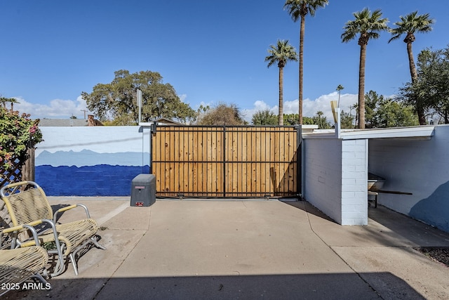 view of gate with fence