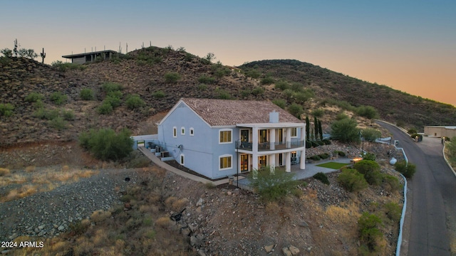 aerial view at dusk with a mountain view