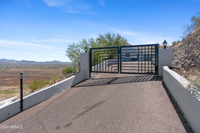 view of gate with a mountain view