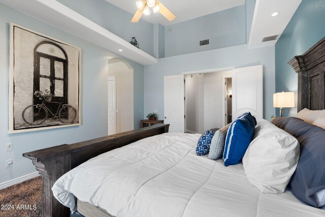 bedroom featuring ceiling fan and lofted ceiling