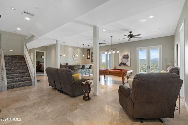 living room with bar area, ceiling fan, billiards, and french doors