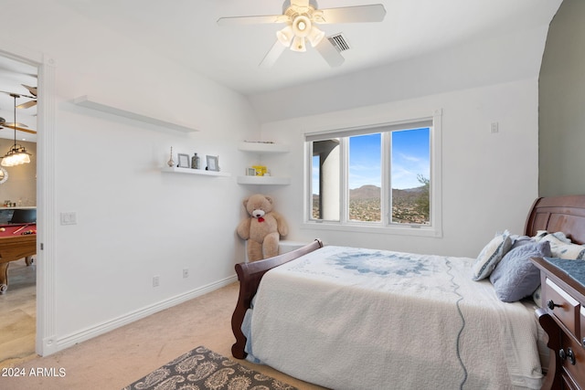 bedroom featuring light carpet and ceiling fan