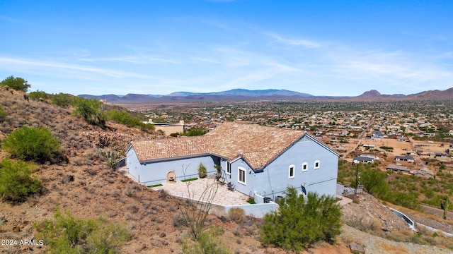 birds eye view of property with a mountain view