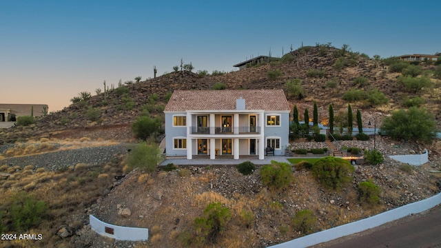 view of front of house with a balcony