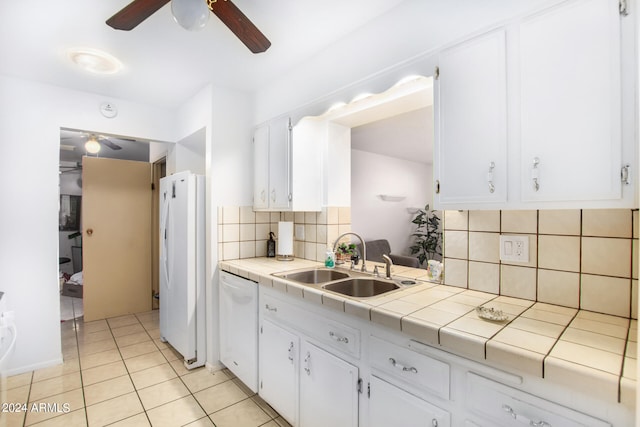 kitchen with white cabinetry, tile counters, sink, white appliances, and decorative backsplash