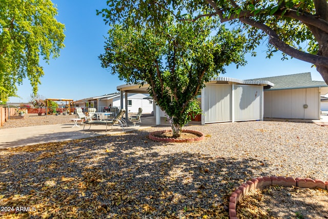 rear view of property featuring a patio