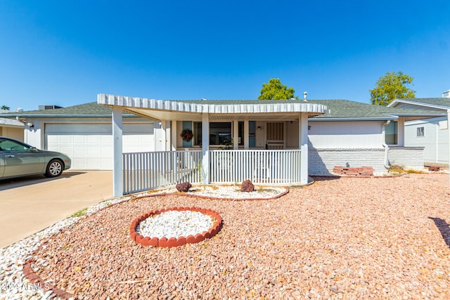 single story home featuring a porch and a garage