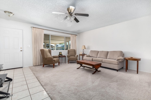 tiled living room featuring a textured ceiling and ceiling fan