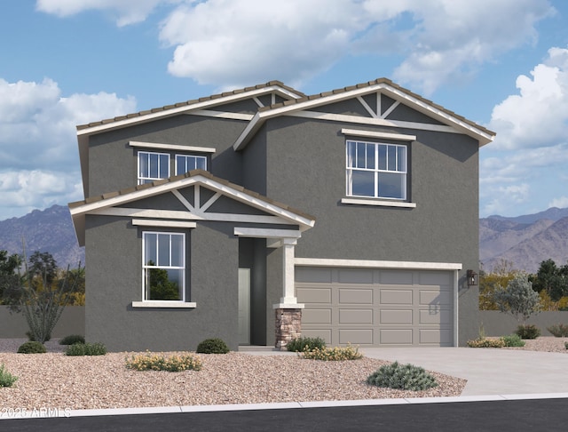 view of front of property with a garage and a mountain view