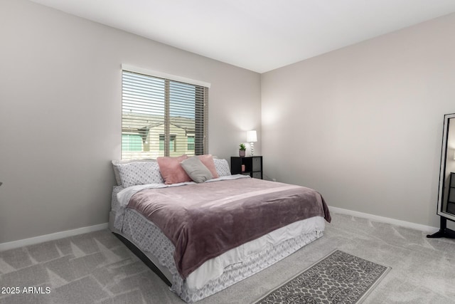 bedroom with carpet floors and baseboards