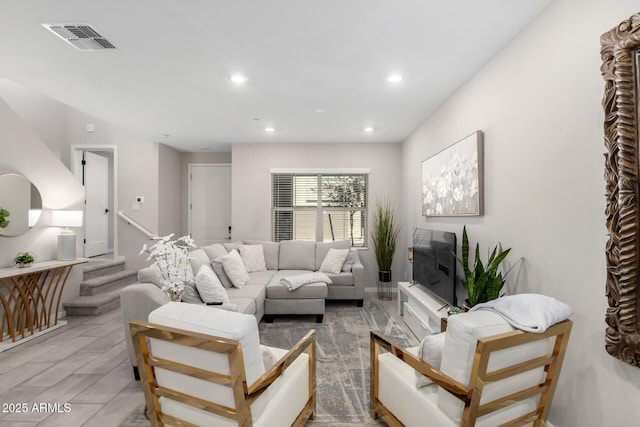 living area with stairs, visible vents, and recessed lighting