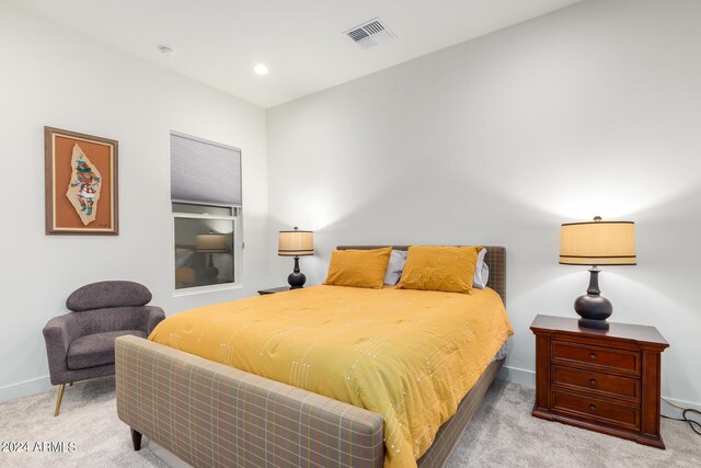 bedroom featuring light colored carpet