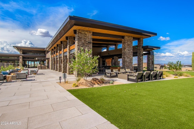 exterior space featuring a lawn and a patio