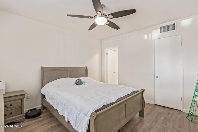 bedroom with hardwood / wood-style floors and ceiling fan